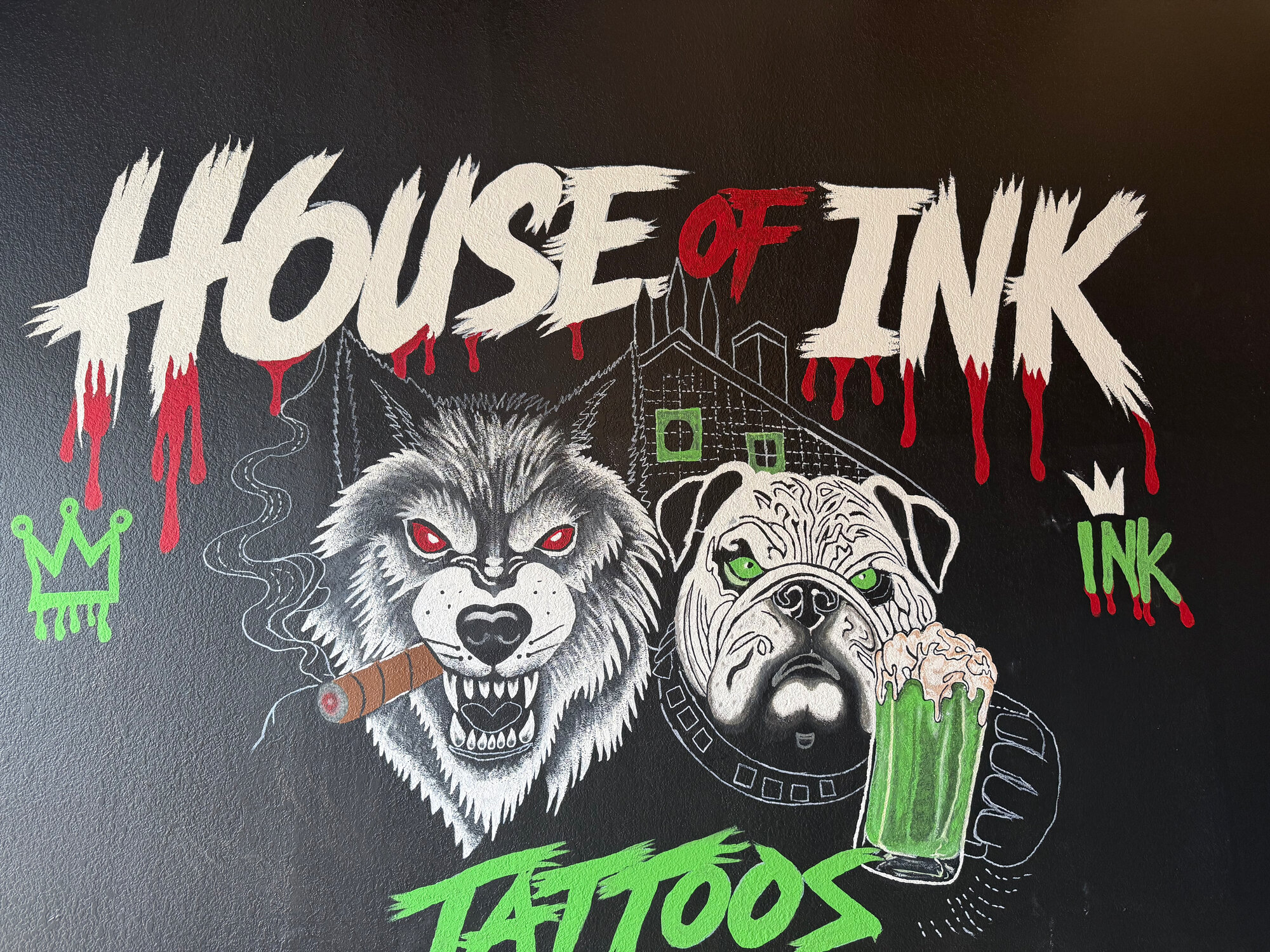 House of Ink logo hand-painted on the studio wall